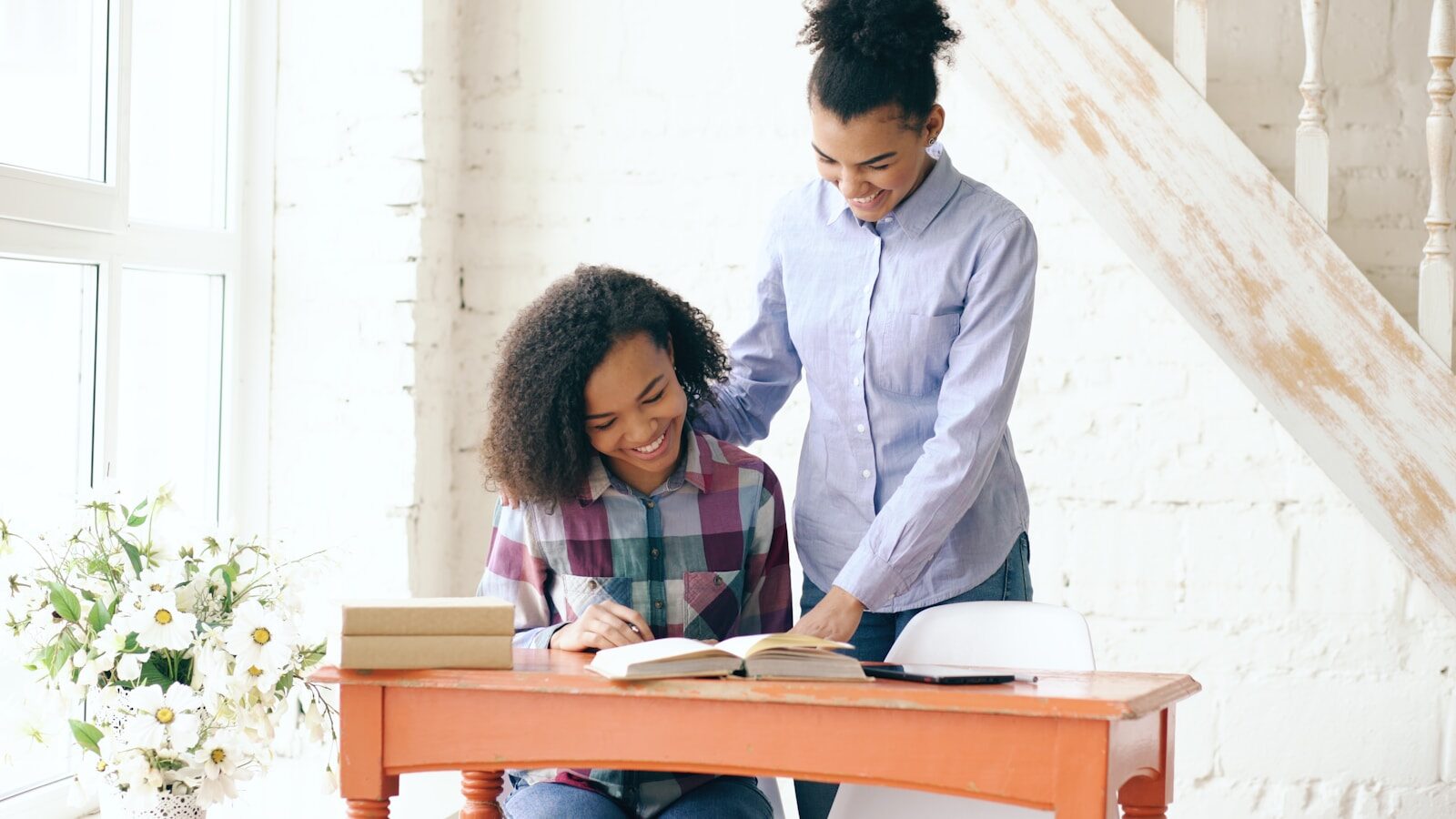 Two women studying at a desk together